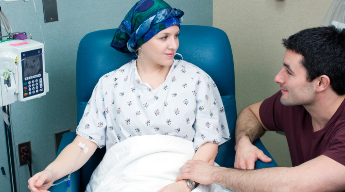 husband comforting his wife during chemotherapy