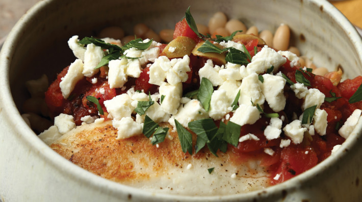 image of Snapper on White Beans with Tomatoes and Green Olives from the ACS cookbook, "Quick and Healthy: 50 Simple Delicious Recipes for Every Day"