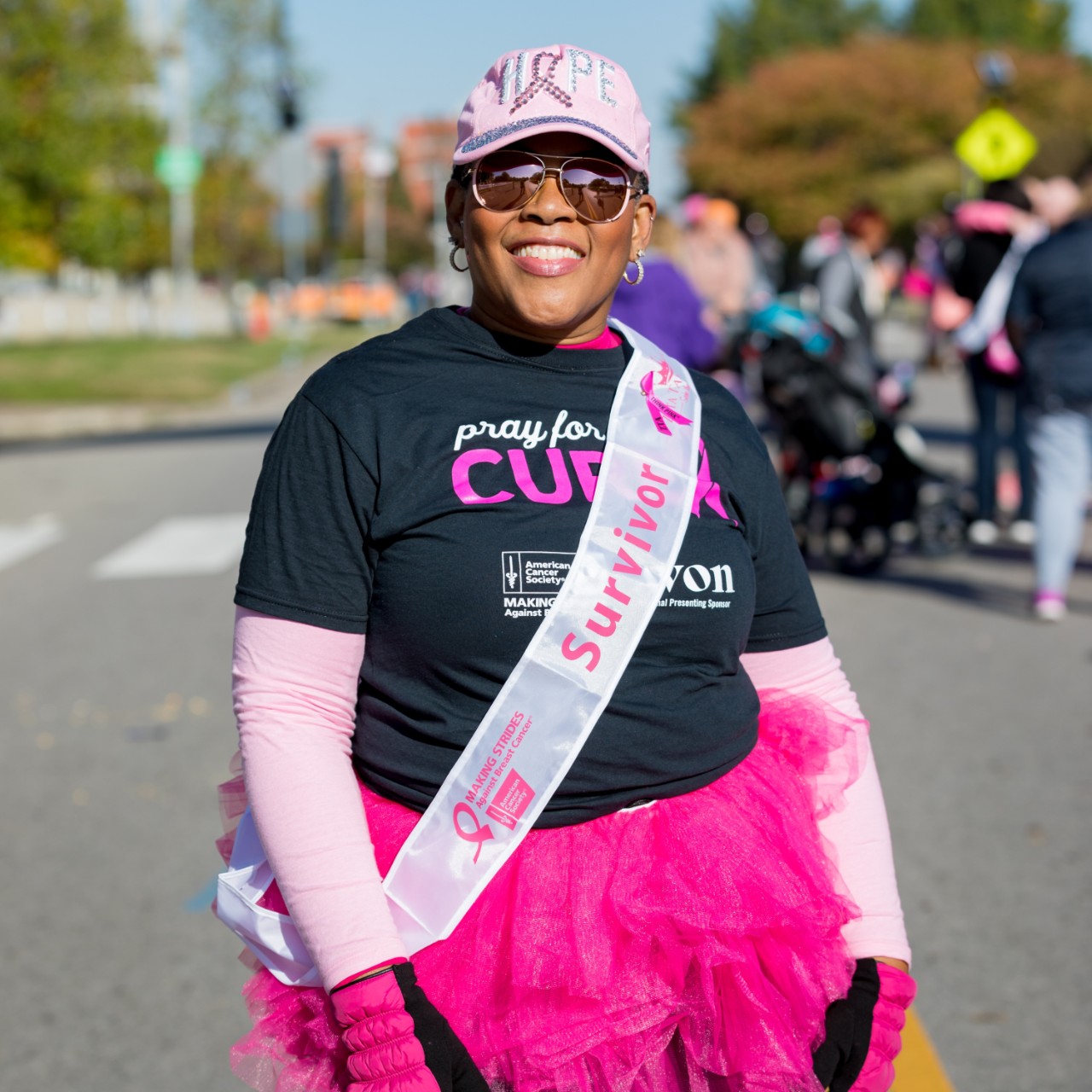 black woman wearing pink tutu at Making Strides Against Breast Cancer Event